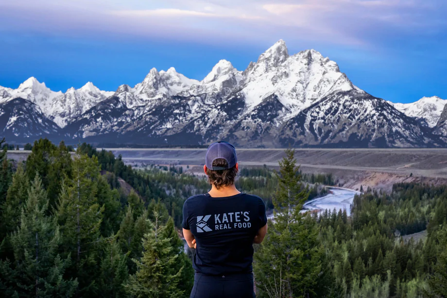 Person wearing Kate's Real Food t-shirt outdoors