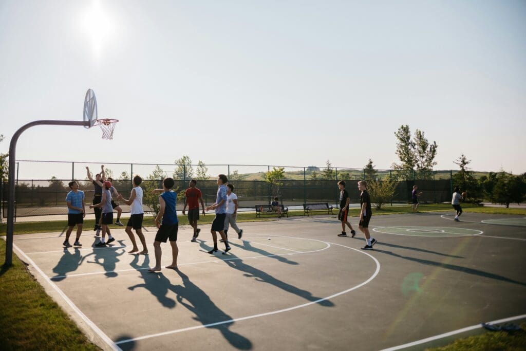People playing outdoor basketball