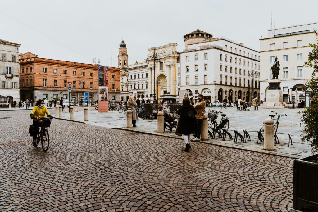 Woman riding back in a city