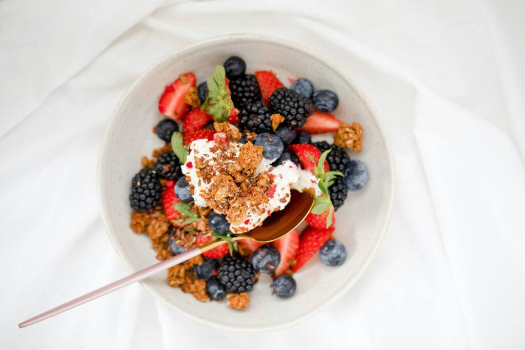 Bowl of fruit and granola.