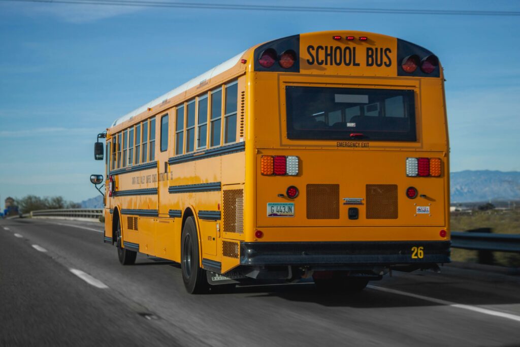 School bus driving down the road.