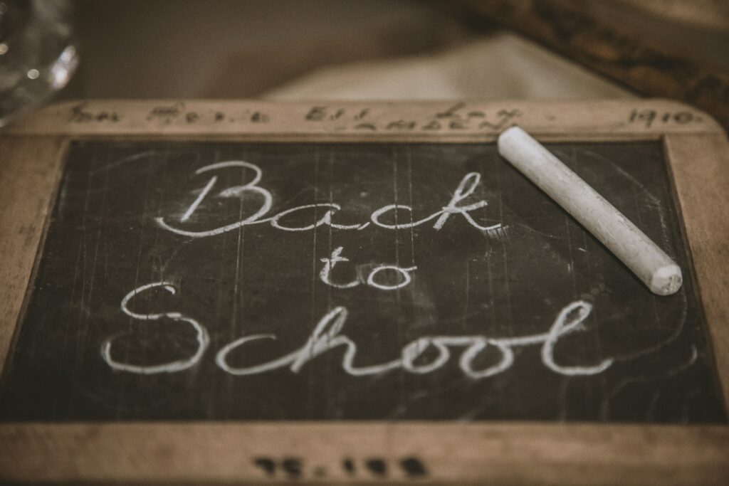 chalkboard sign reading "back to school"