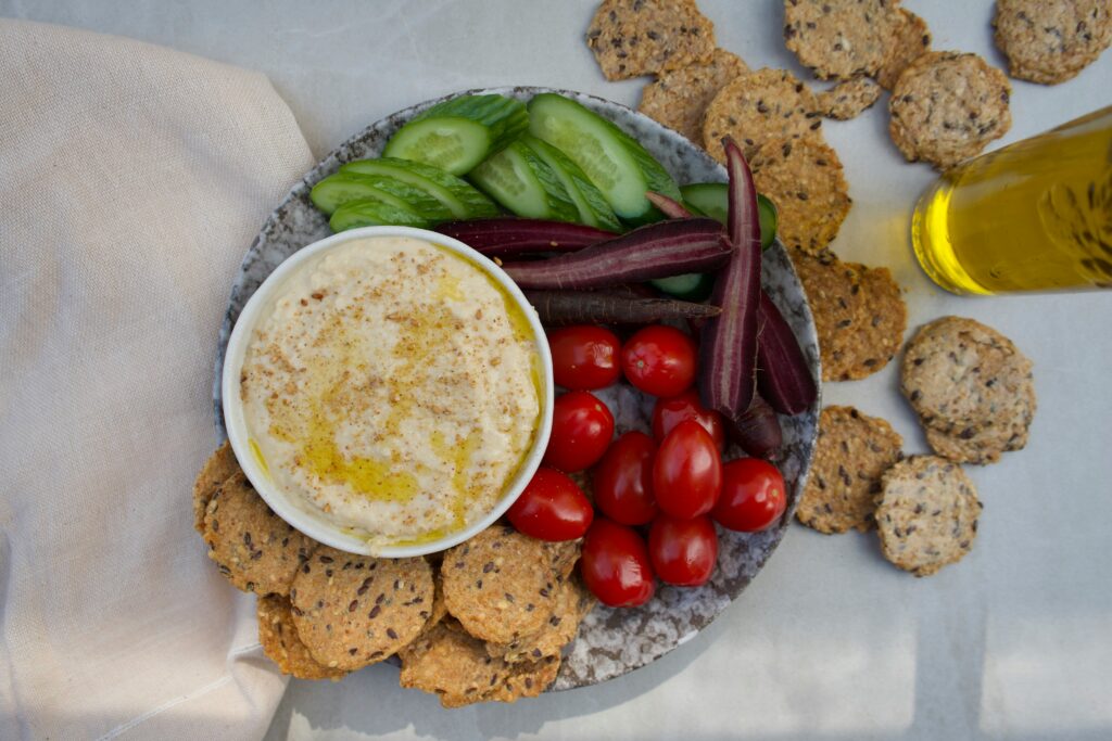 Hummus with veggies and seed crackers